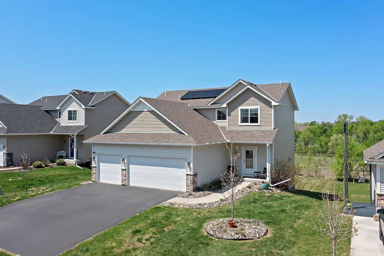 Home with solar panels front, installed by Wolf River Electric