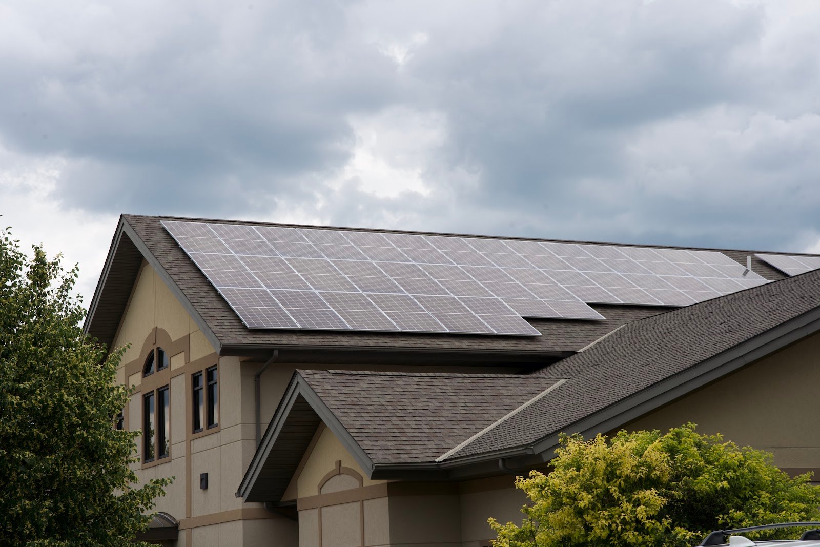 Home with solar panels lawn, installed by Wolf River Electric