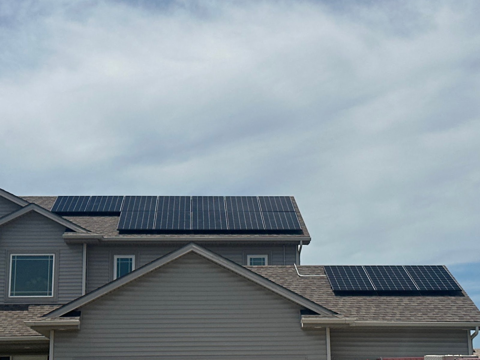Home with solar panels overcast, installed by Wolf River Electric