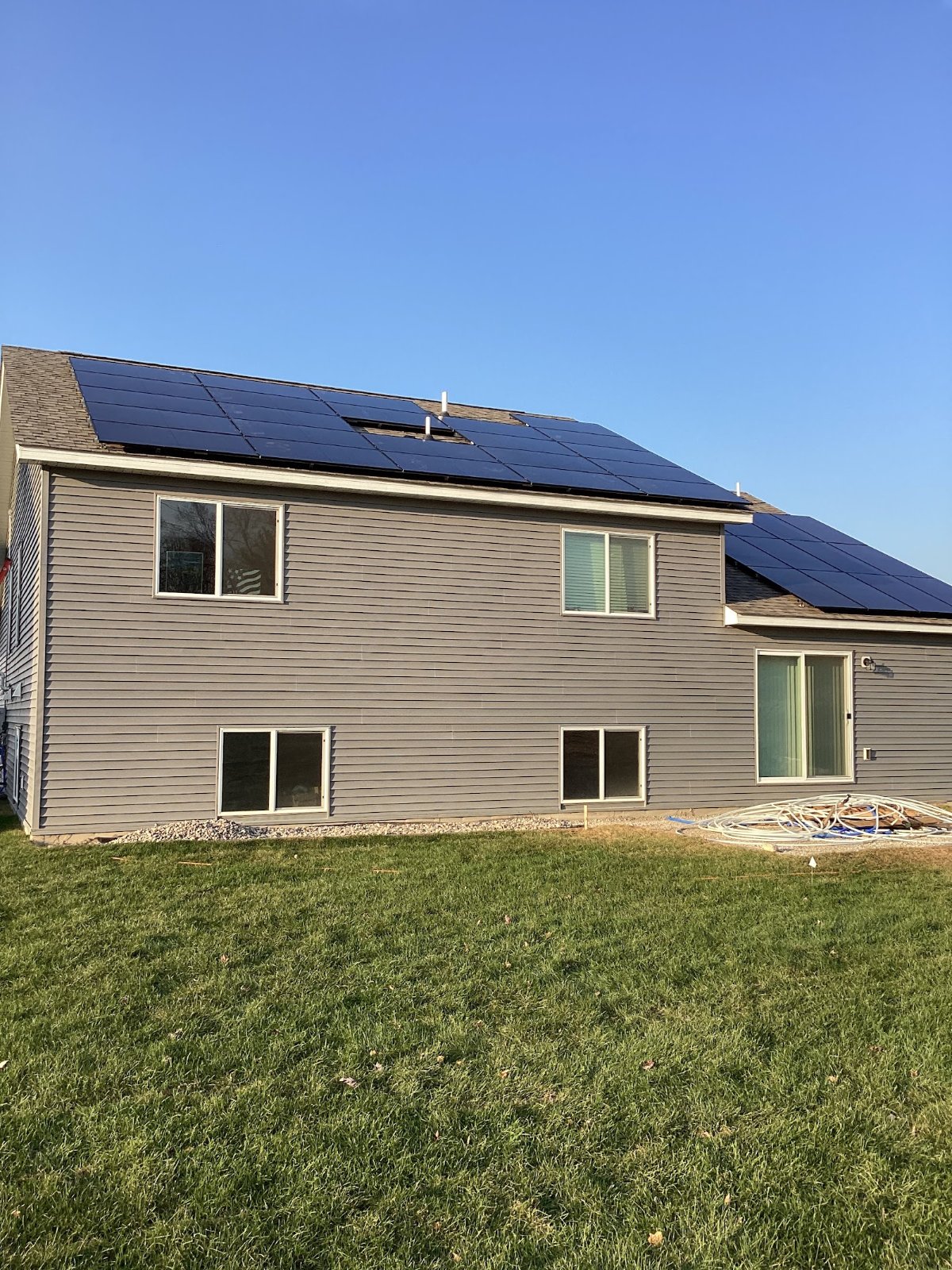 Home with solar panels two story, installed by Wolf River Electric