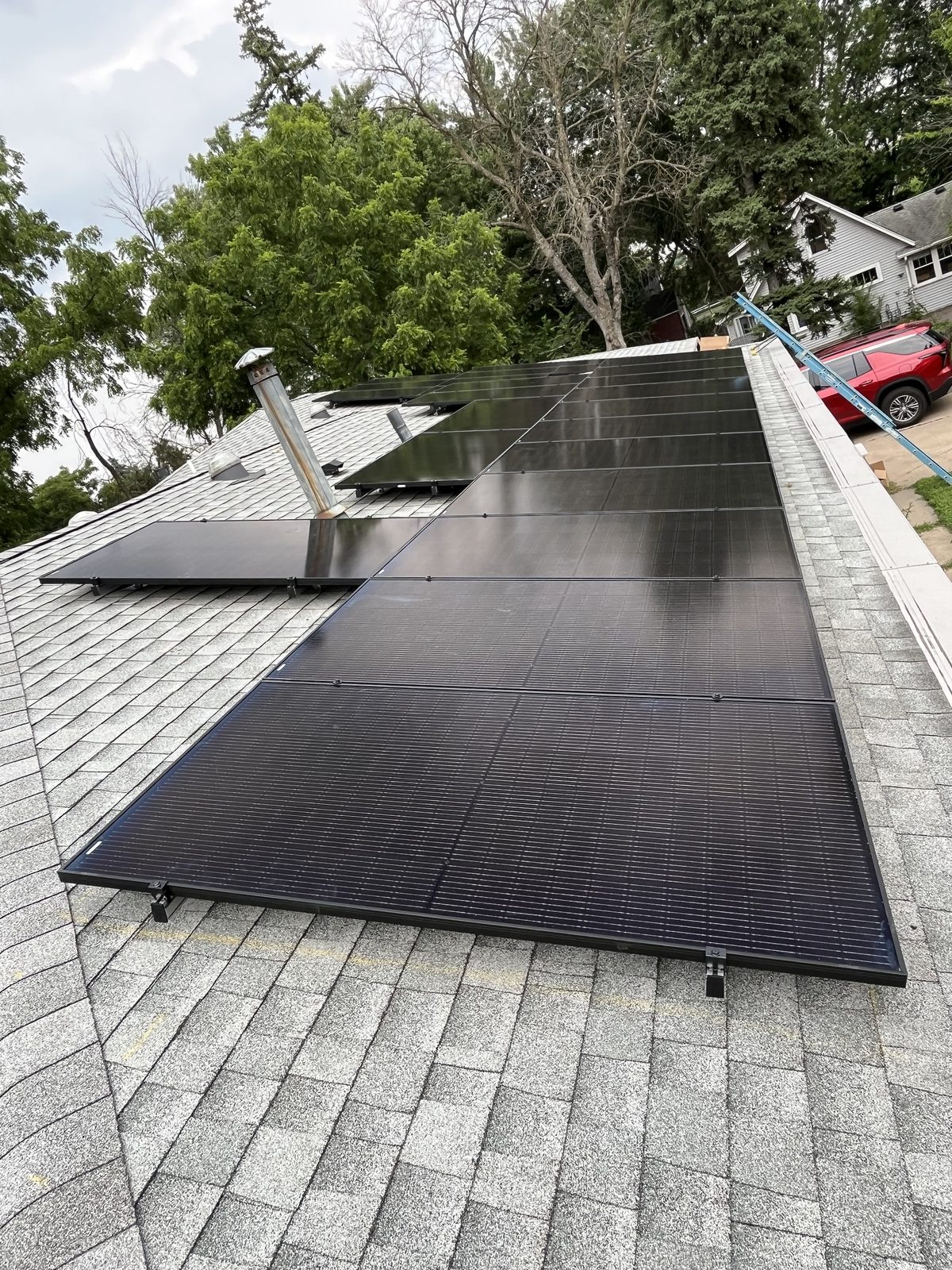 Long solar array on shingles, installed by Wolf River Electric