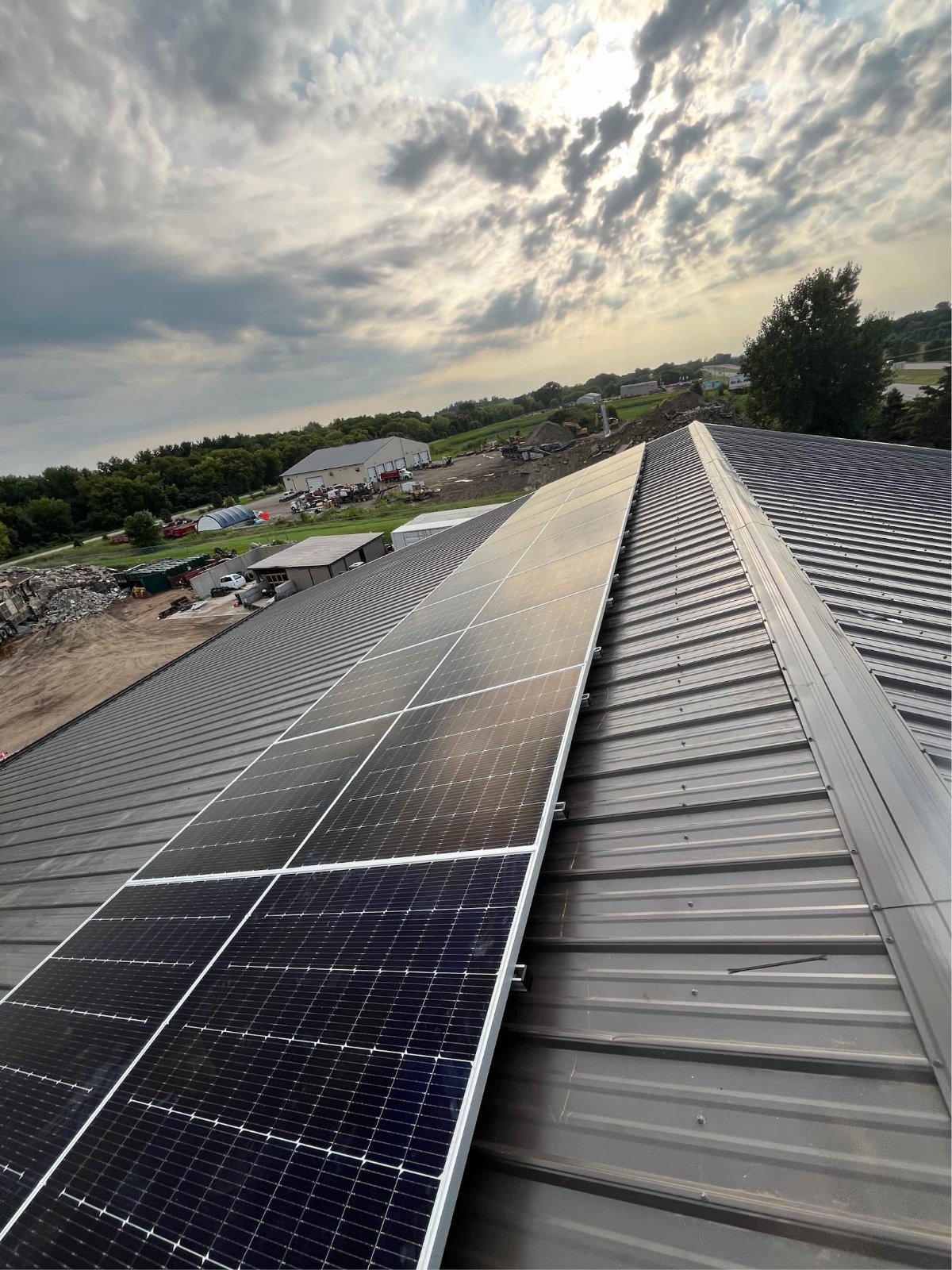 Metal roof long solar array, installed by Wolf River Electric