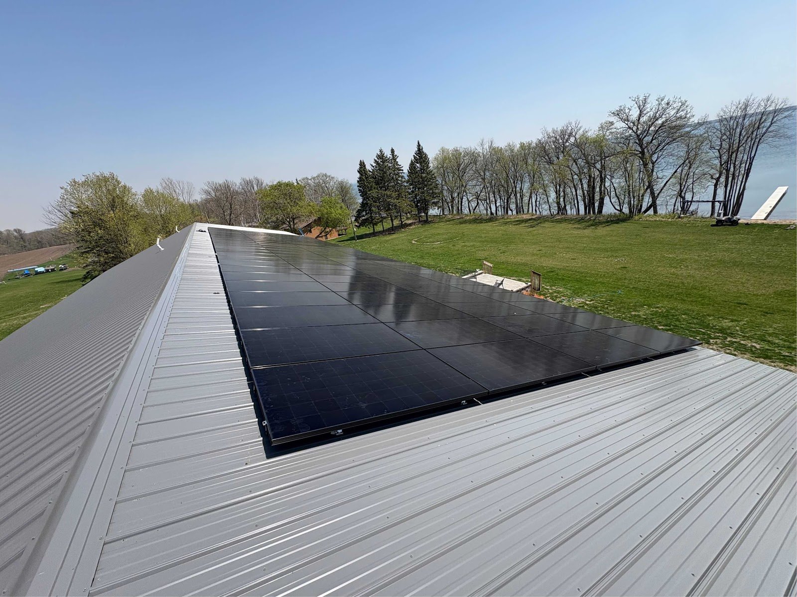 Metal roof solar panels field, installed by Wolf River Electric