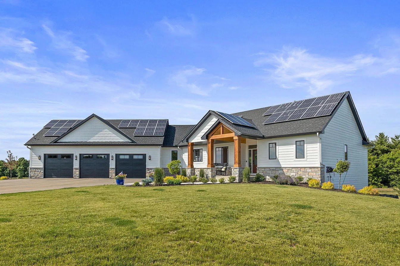 New home with solar panels, installed by Wolf River Electric