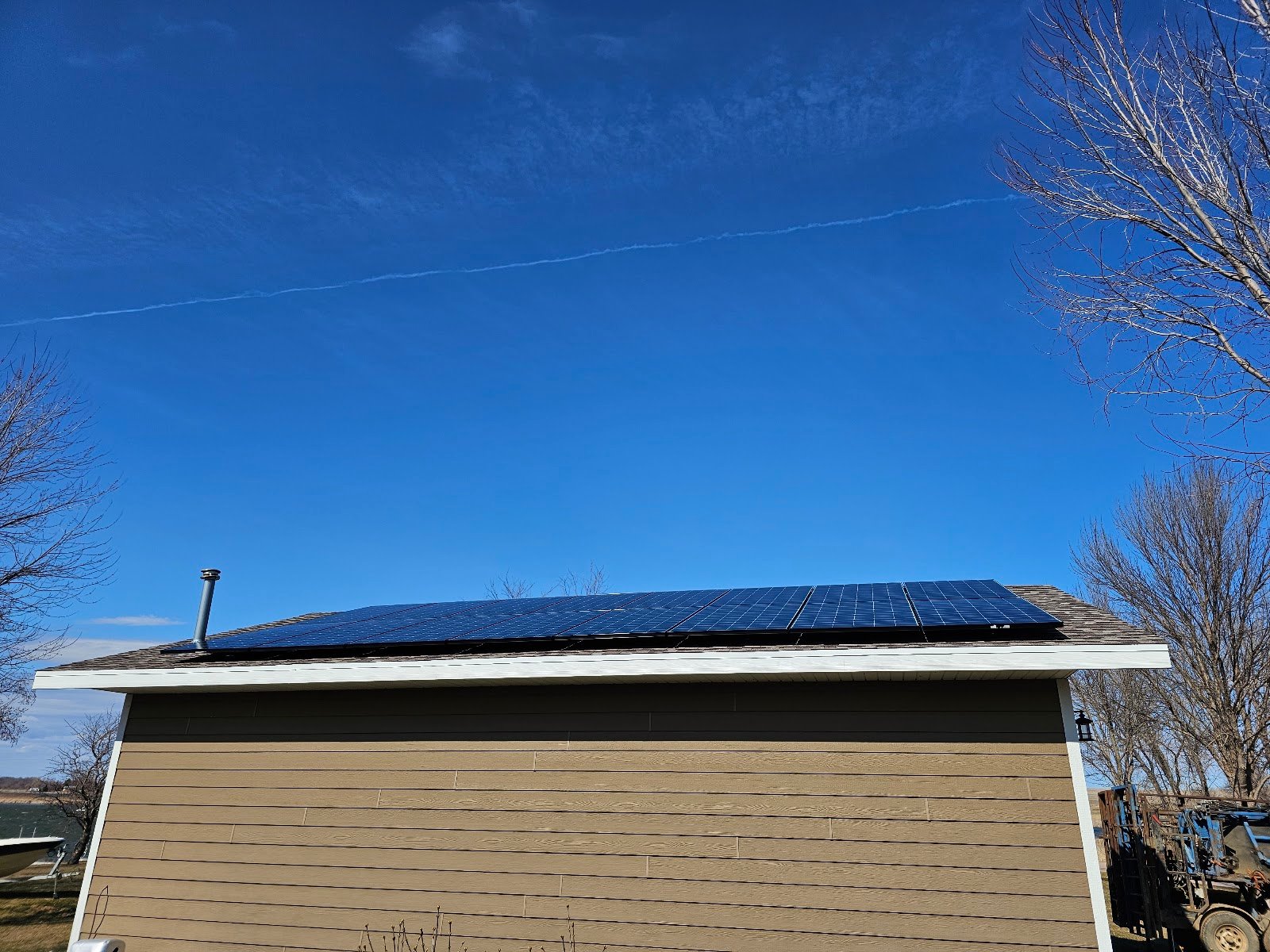 Roof solar panels clear sky, installed by Wolf River Electric