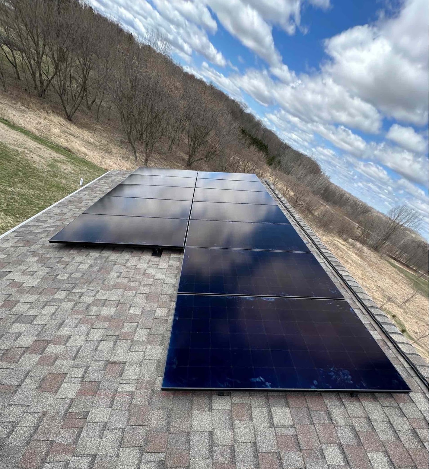 Roof solar panels hillside view, installed by Wolf River Electric
