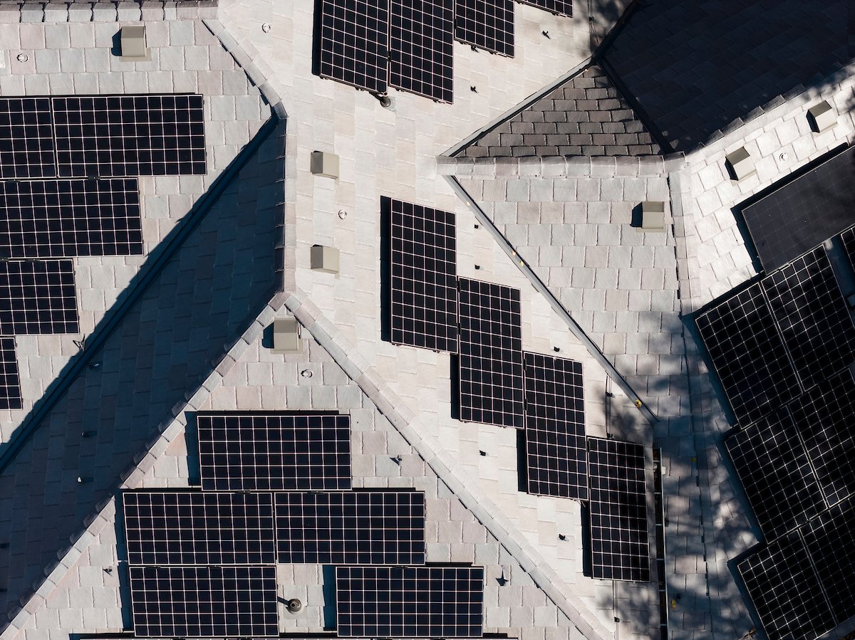 Solar array on a hip roof, top-down aerial view, installed by Wolf River Electric