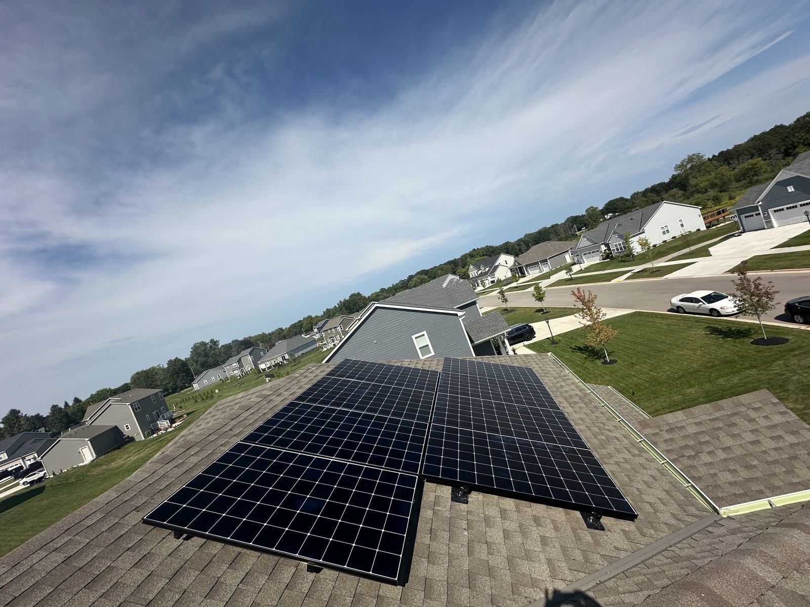 Solar array with suburban view, installed by Wolf River Electric