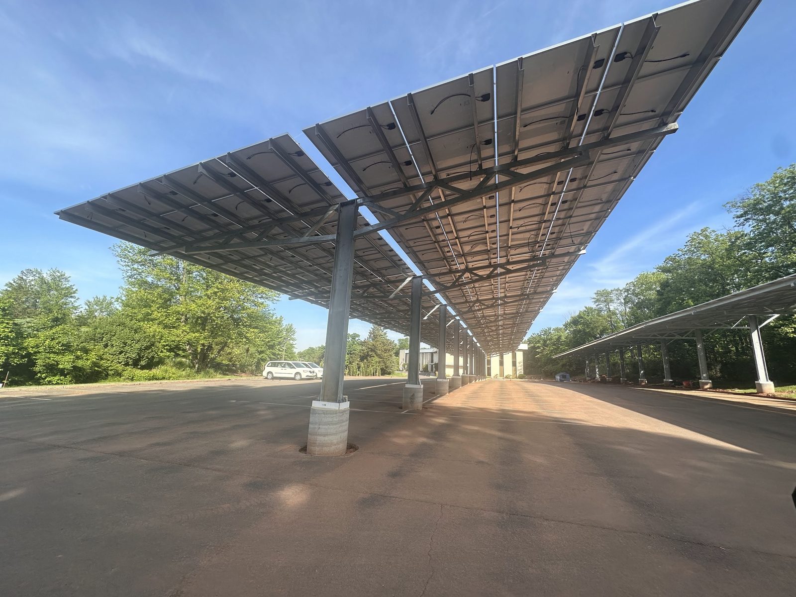 Solar carport canopy row, installed by Wolf River Electric