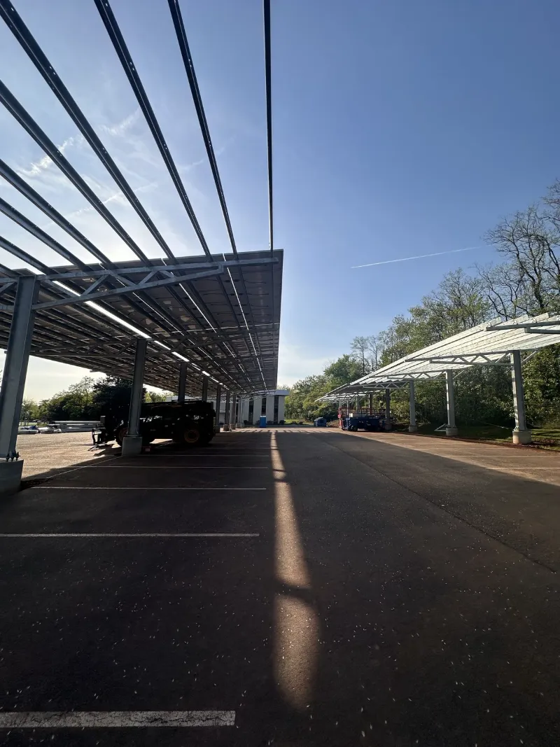 Solar carport canopies over a commercial parking lot, installed by Wolf River Electric
