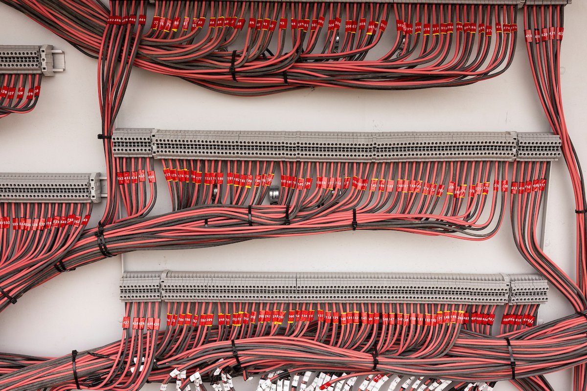 Neat solar wiring in a combiner panel, Wolf River Electric electrical work