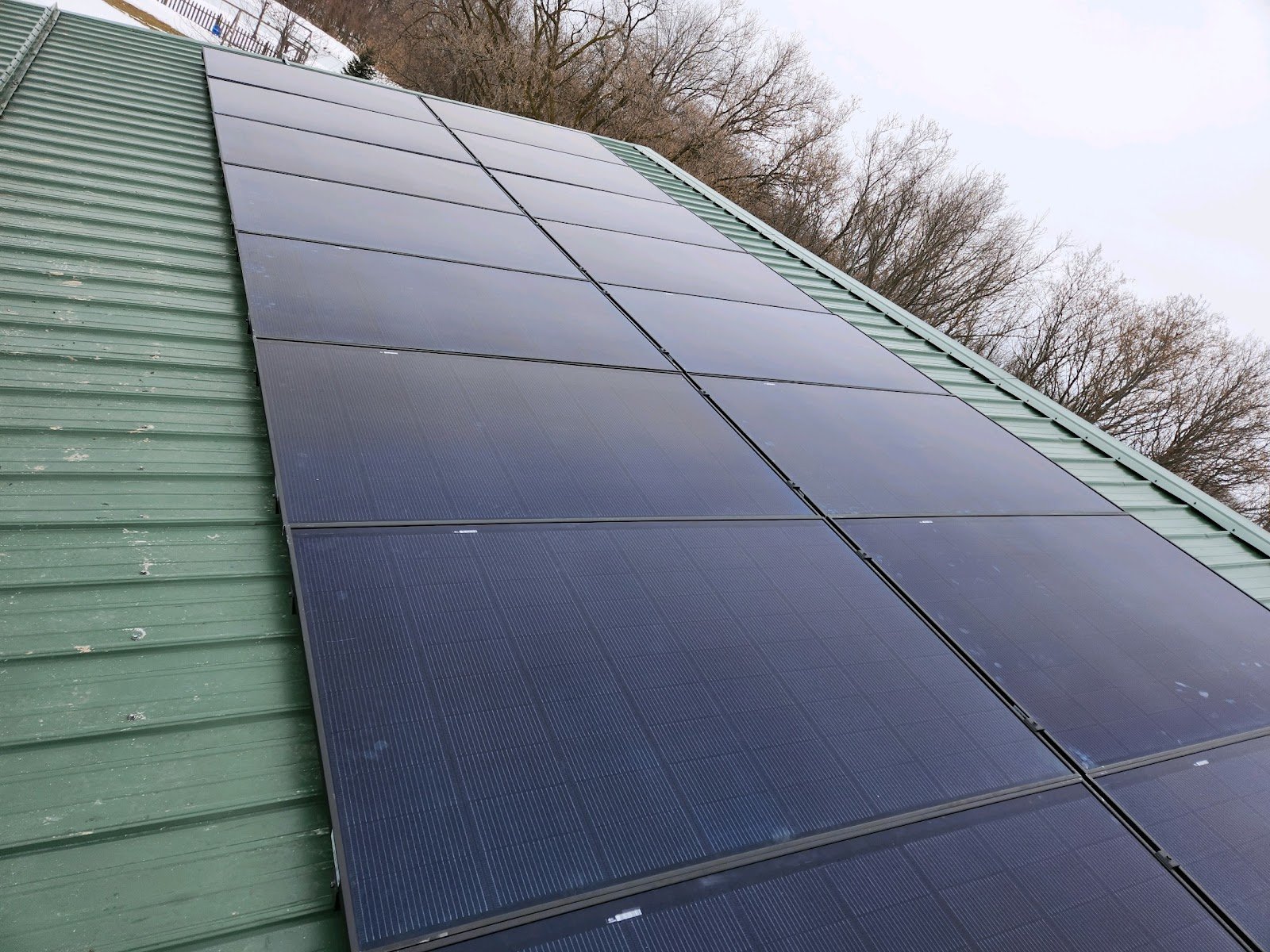 Solar panels close metal roof, installed by Wolf River Electric