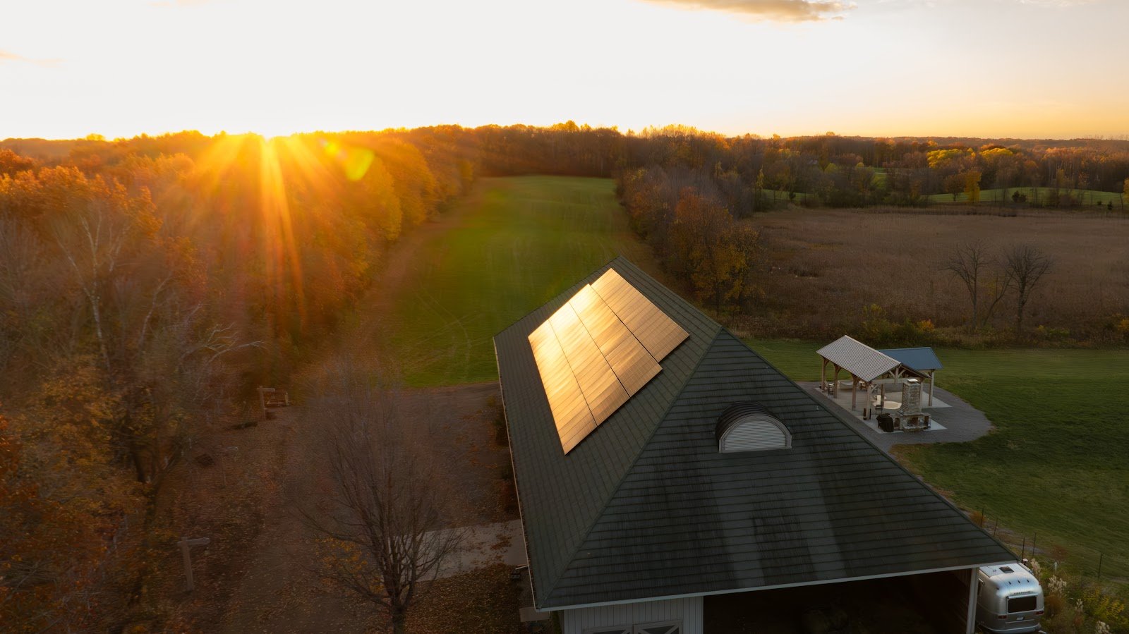 Sunset aerial home with rooftop solar, installed by Wolf River Electric