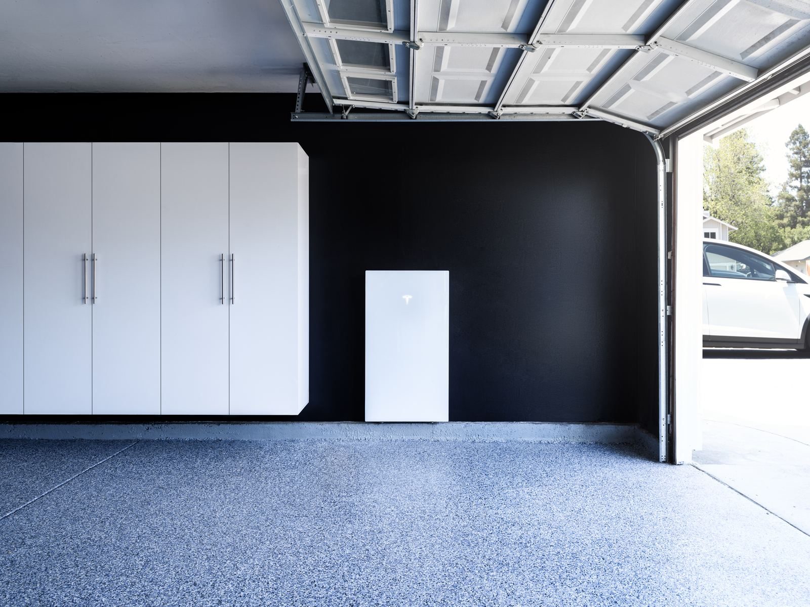 Tesla Powerwall installed on a garage wall