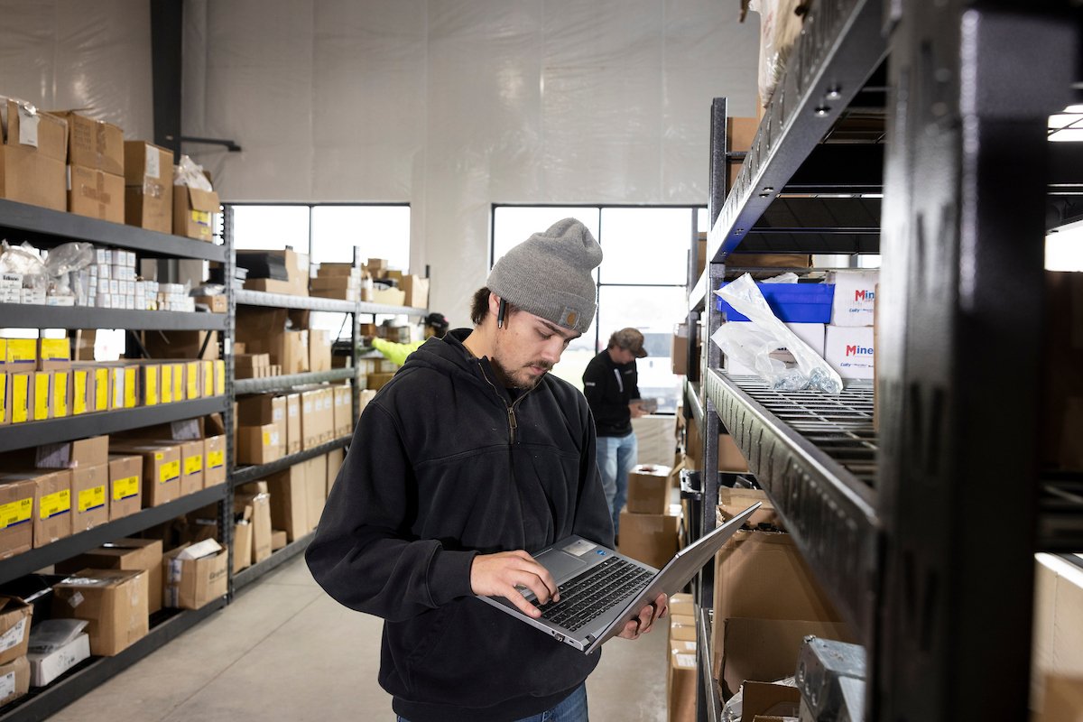 Wolf River Electric warehouse staff checking inventory